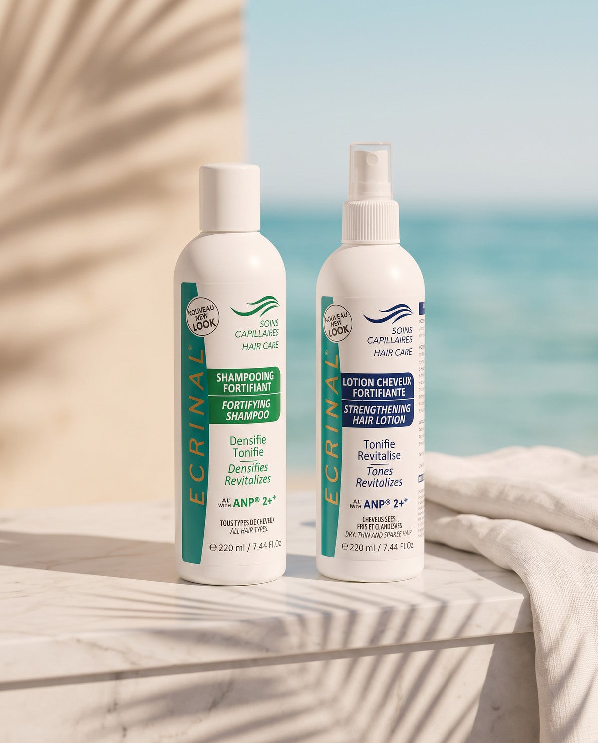 Ecrinal ANP2+ fortifying shampoo and strengthening hair lotion on a marble ledge by the sea